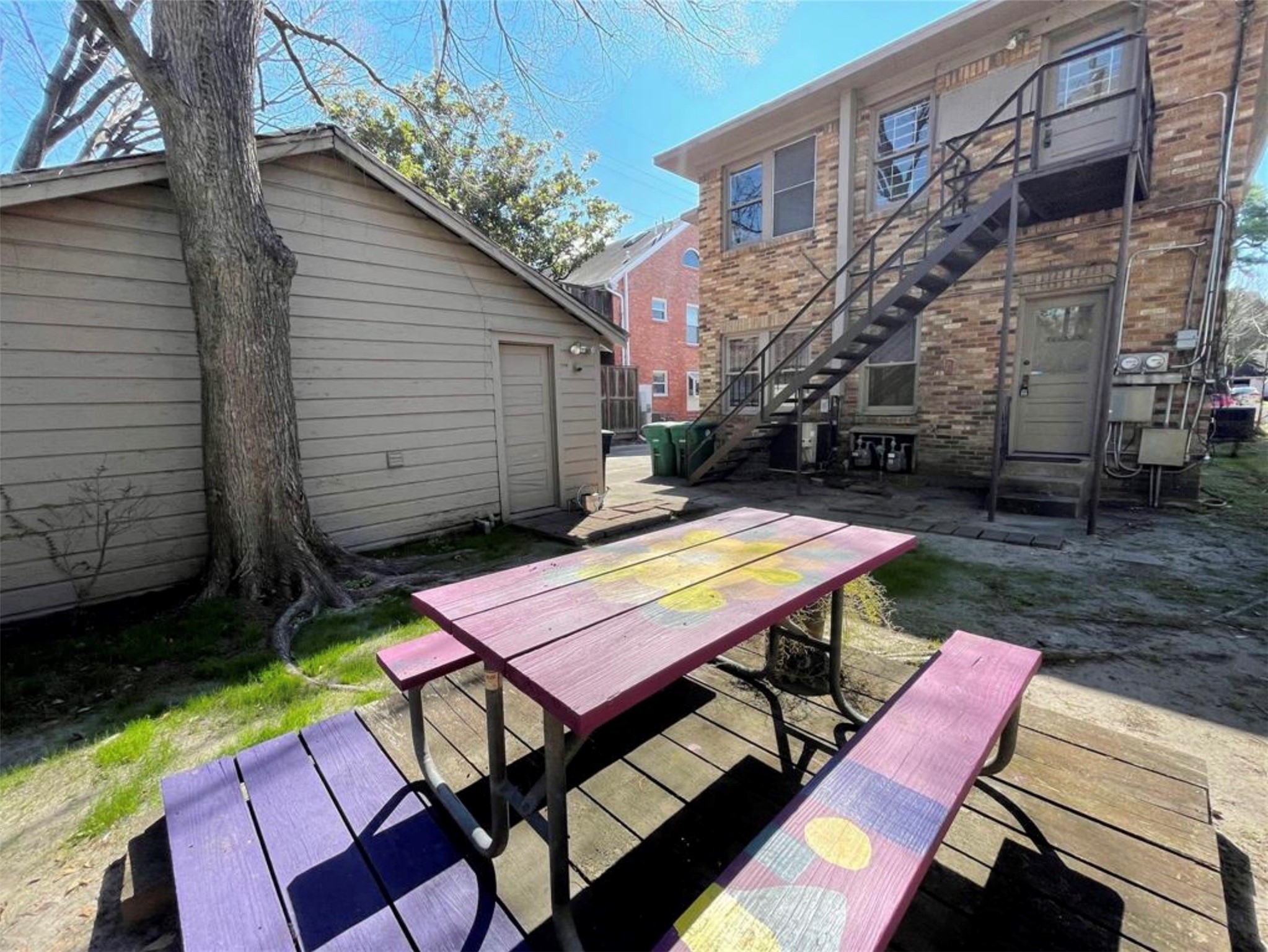 1706 Hawthorne Street Houston, TX 77098 - Photo 16 of 25 a backyard of a house with barbeque oven table and chairs