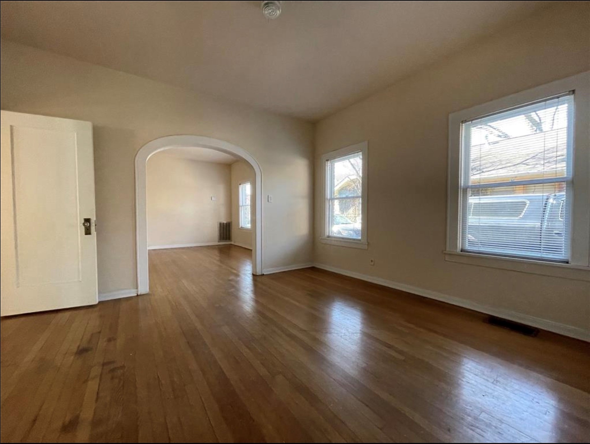 1706 Hawthorne Street Houston, TX 77098 - Photo 3 of 25 a view of empty room with wooden floor and fan