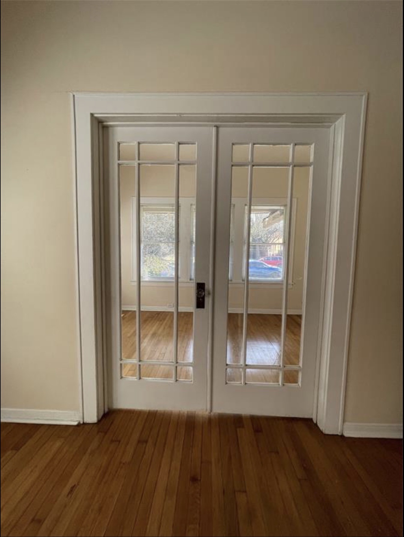 1706 Hawthorne Street Houston, TX 77098 - Photo 10 of 25 an empty room with wooden floor and windows