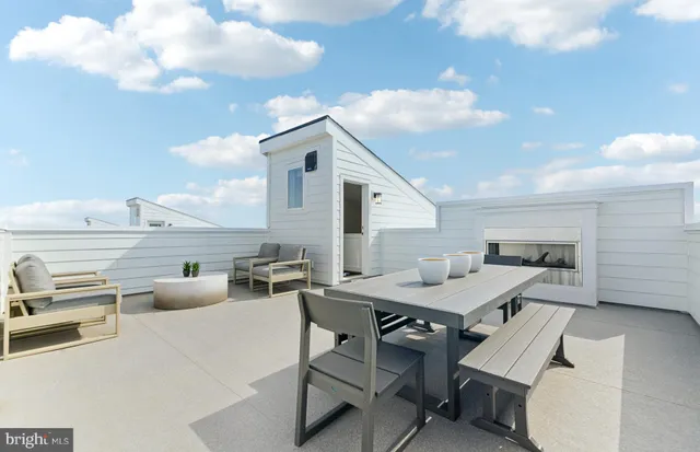 a bedroom with a bed and painting on the wall