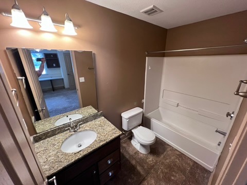 203 Kelly Road, Unit 114 Clemson, SC 29631 - Photo 26 of 37 Granite counters and tile floors elevate this functional full bathroom.