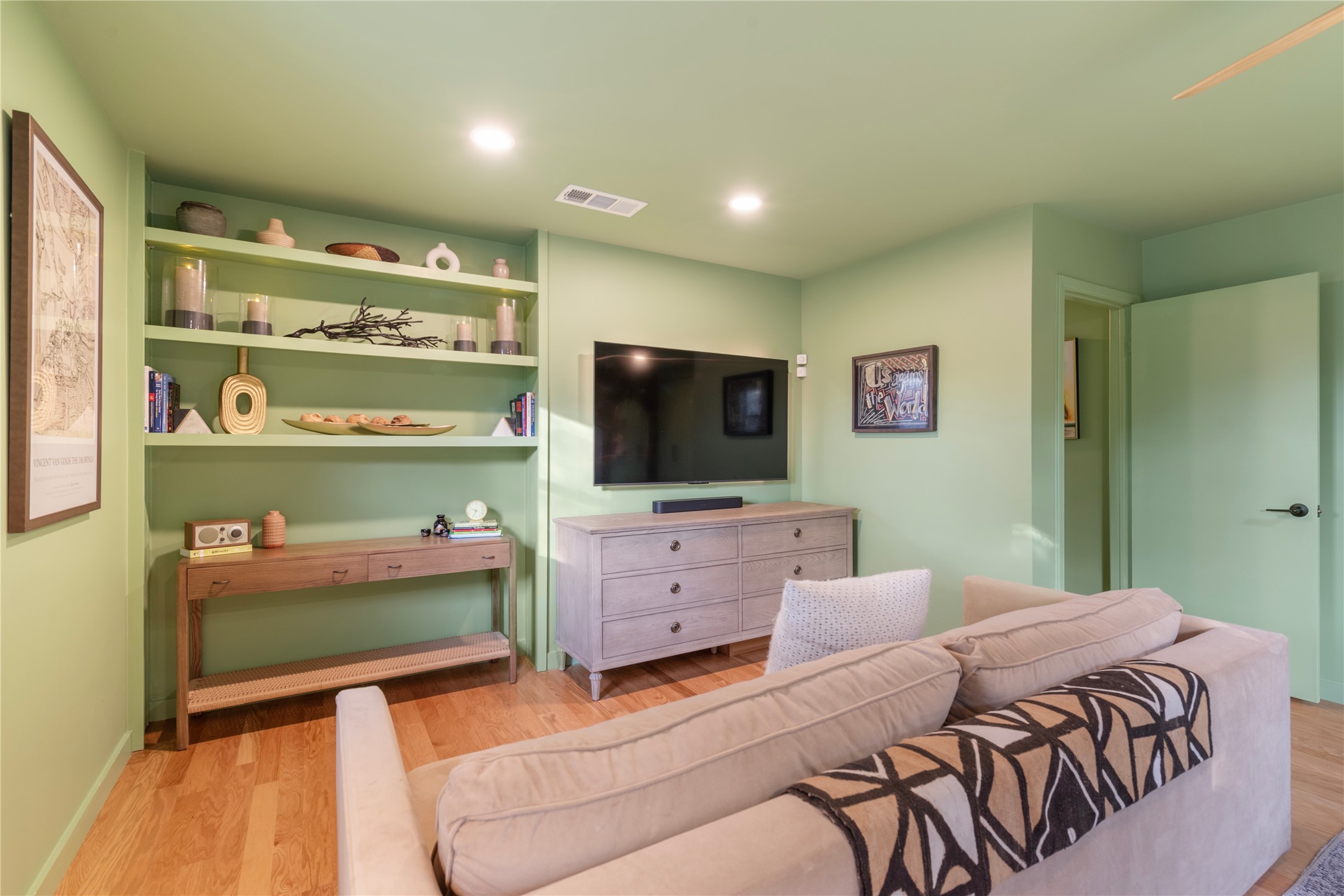 1106 Mission Ridge, Unit B Austin, TX 78704 - Photo 11 of 27 a bedroom with a bed and flat screen tv