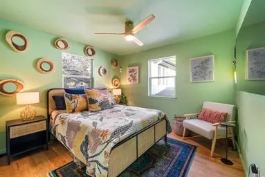 a bedroom with a bed and a window