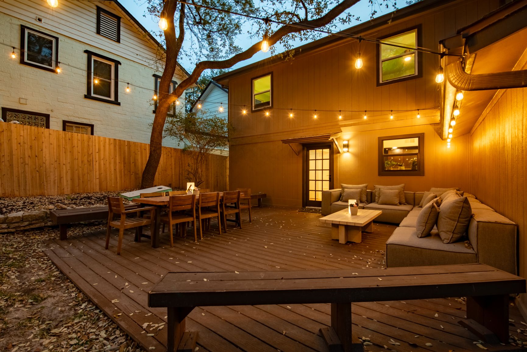 1106 Mission Ridge, Unit B Austin, TX 78704 - Photo 23 of 27 a view of a patio with dining table and chairs with a barbeque grill and couches