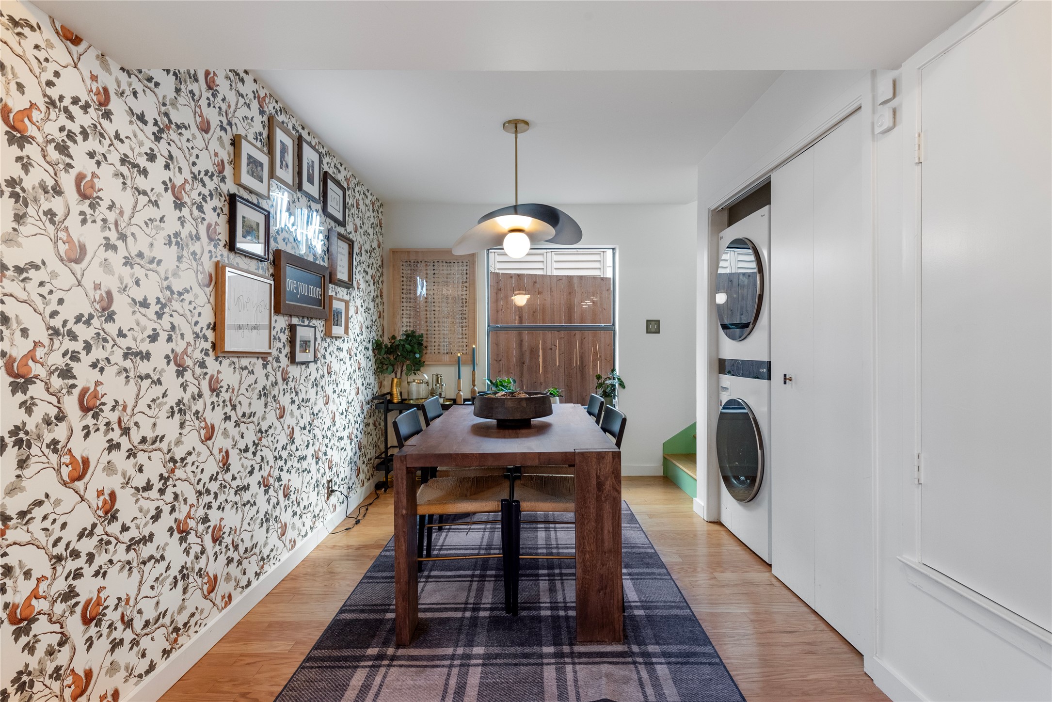 1106 Mission Ridge, Unit B Austin, TX 78704 - Photo 8 of 27 a dining room with furniture and a chandelier