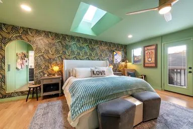 a bedroom with a bed window and a table