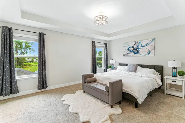 a bedroom with bed and a window