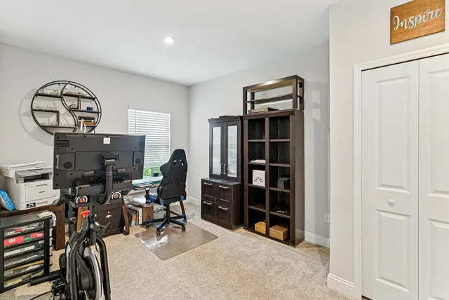 a view of a workspace with furniture