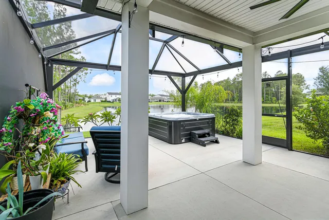 a building outdoor space with patio furniture and potted plants