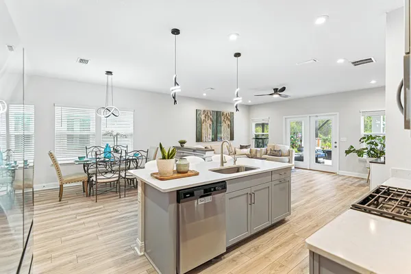a large kitchen with a table and chairs