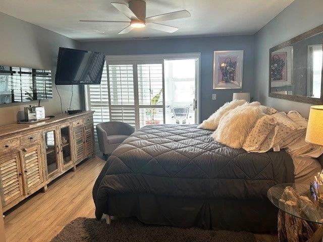 4396 Baldwin Avenue, Unit 82 Little River, SC 29566 - Photo 12 of 31 Bedroom featuring multiple windows, ceiling fan, and wood finished floors