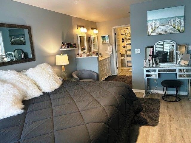 4396 Baldwin Avenue, Unit 82 Little River, SC 29566 - Photo 13 of 31 Bedroom featuring wood finished floors and baseboards