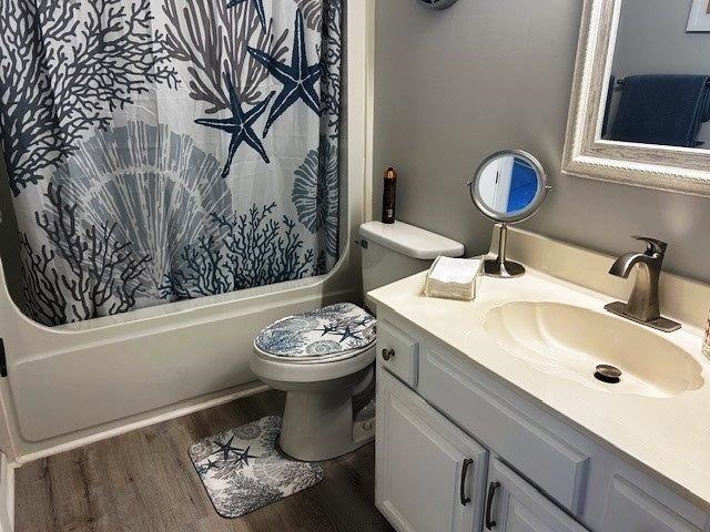 4396 Baldwin Avenue, Unit 82 Little River, SC 29566 - Photo 18 of 31 Full bathroom featuring vanity, wood finished floors, and shower / tub combo