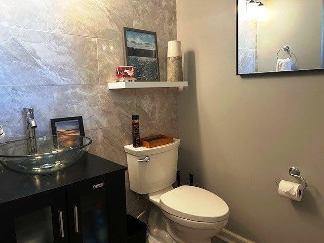 4396 Baldwin Avenue, Unit 82 Little River, SC 29566 - Photo 20 of 31 Half bath with vanity and decorative backsplash