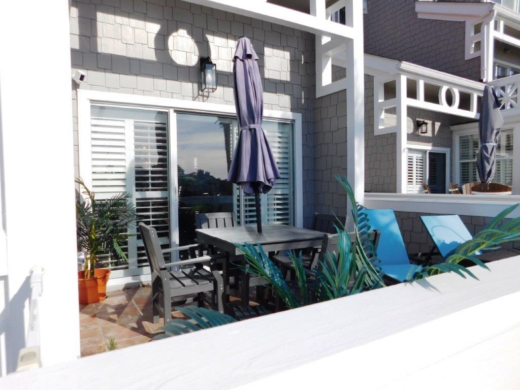 4396 Baldwin Avenue, Unit 82 Little River, SC 29566 - Photo 22 of 31 View of patio featuring outdoor dining area