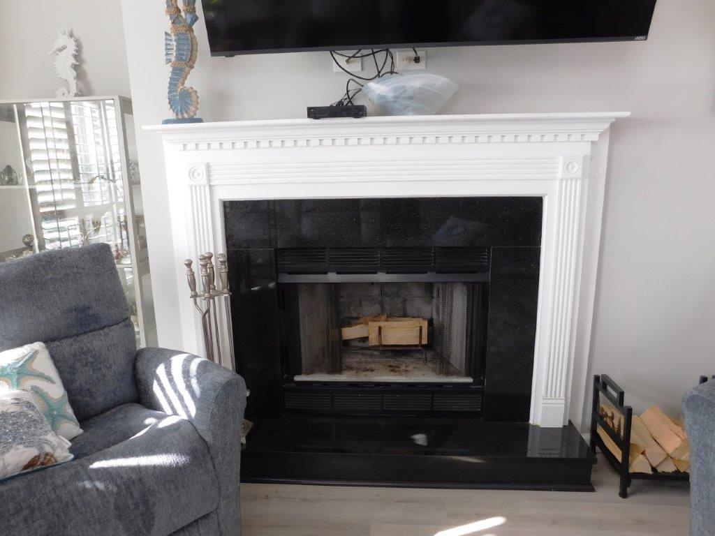 4396 Baldwin Avenue, Unit 82 Little River, SC 29566 - Photo 4 of 31 Detailed view of a fireplace and wood finished floors