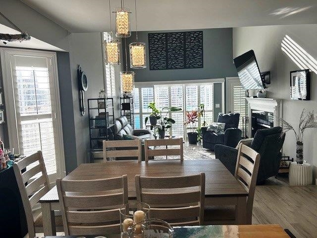4396 Baldwin Avenue, Unit 82 Little River, SC 29566 - Photo 6 of 31 Dining area with wood finished floors and plenty of natural light