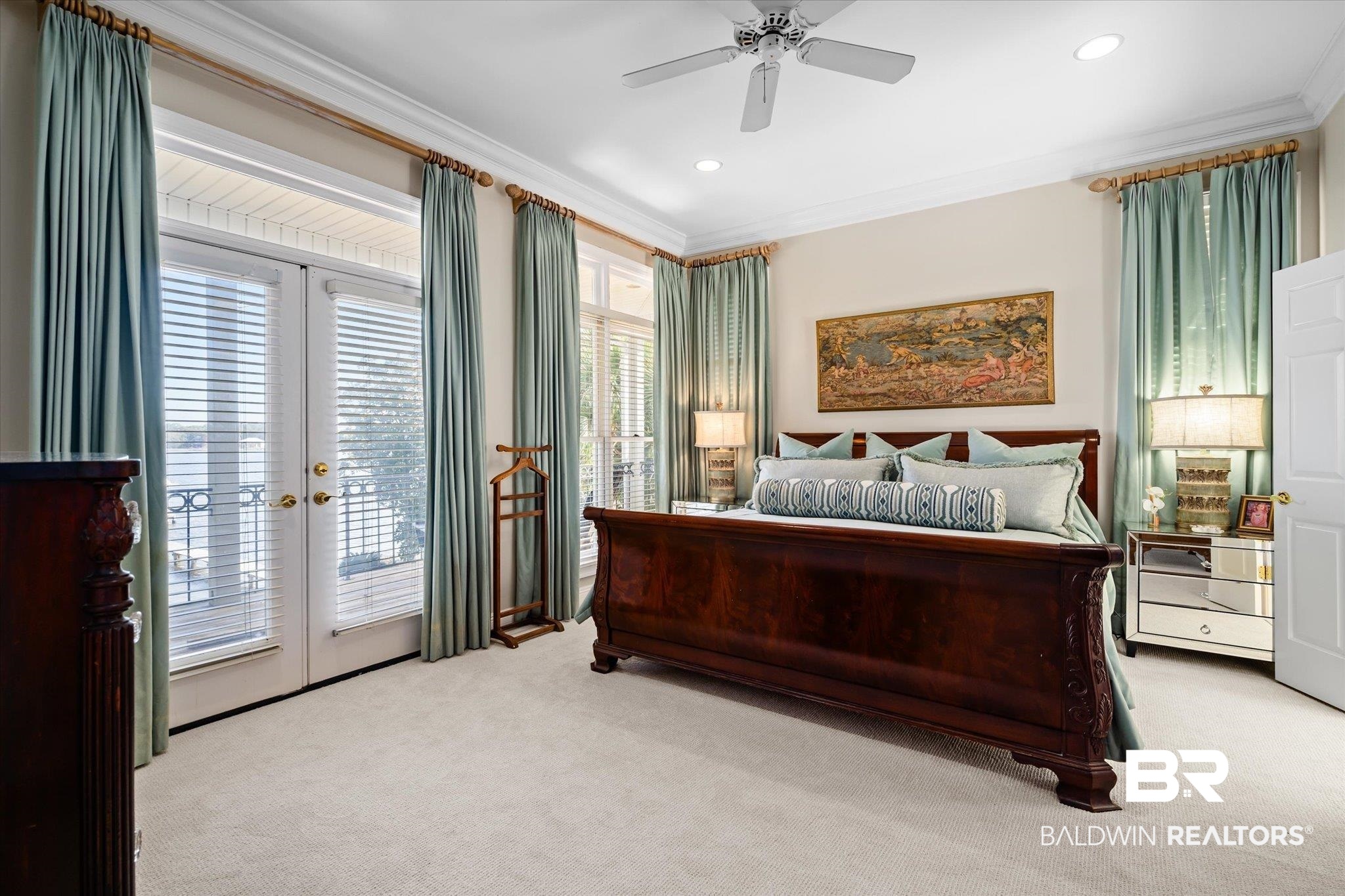 4930 River Trace Theodore, AL 36582 - Photo 20 of 57 Bedroom featuring french doors, multiple windows, light colored carpet, and crown molding