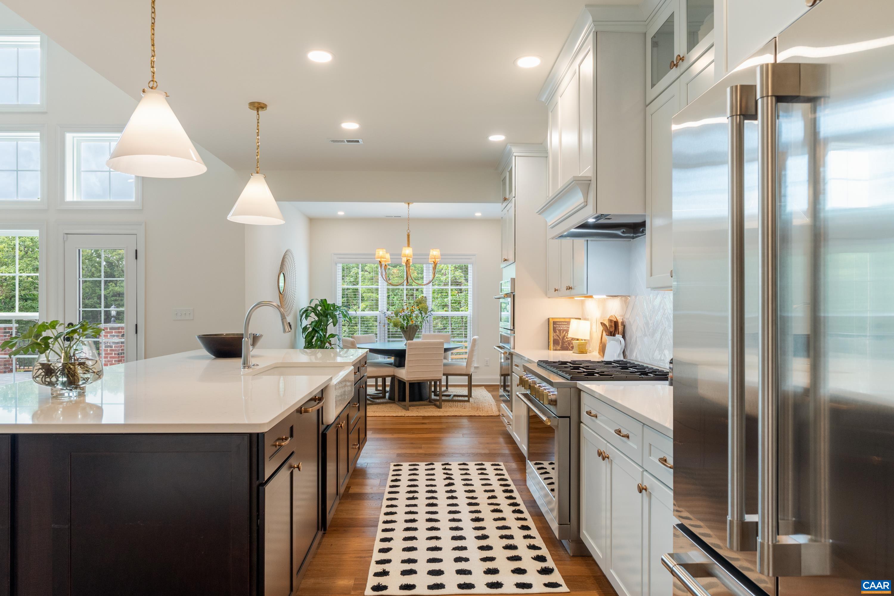240 Campbell Road Keswick, VA 22947 - Photo 19 of 68 a kitchen with stainless steel appliances granite countertop a sink a stove and a refrigerator