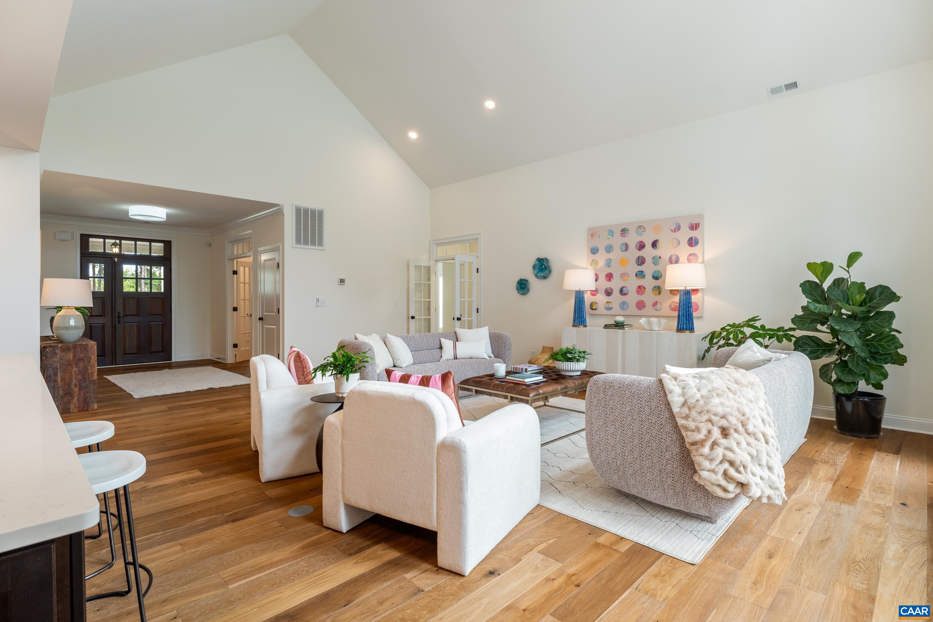 240 Campbell Road Keswick, VA 22947 - Photo 20 of 68 a living room with furniture and a potted plant