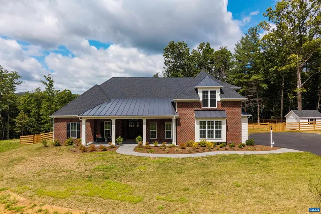 a front view of a house with swimming pool