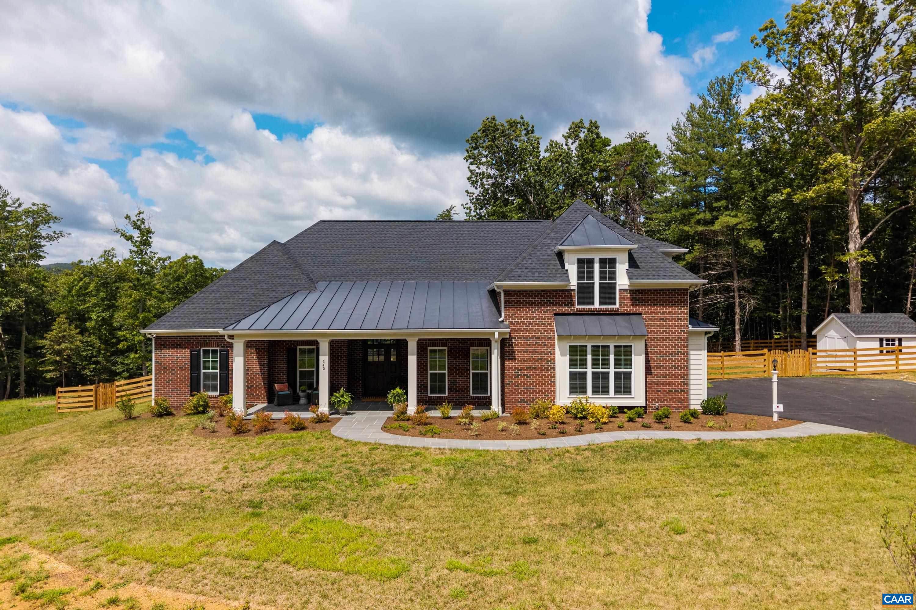 240 Campbell Road Keswick, VA 22947 - Photo 2 of 68 a front view of a house with swimming pool