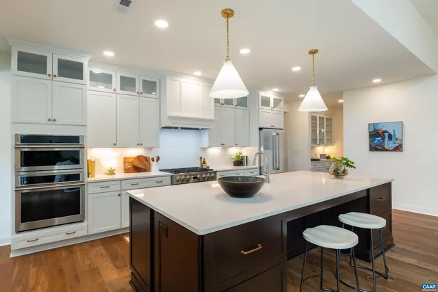 a dining room with furniture and a window