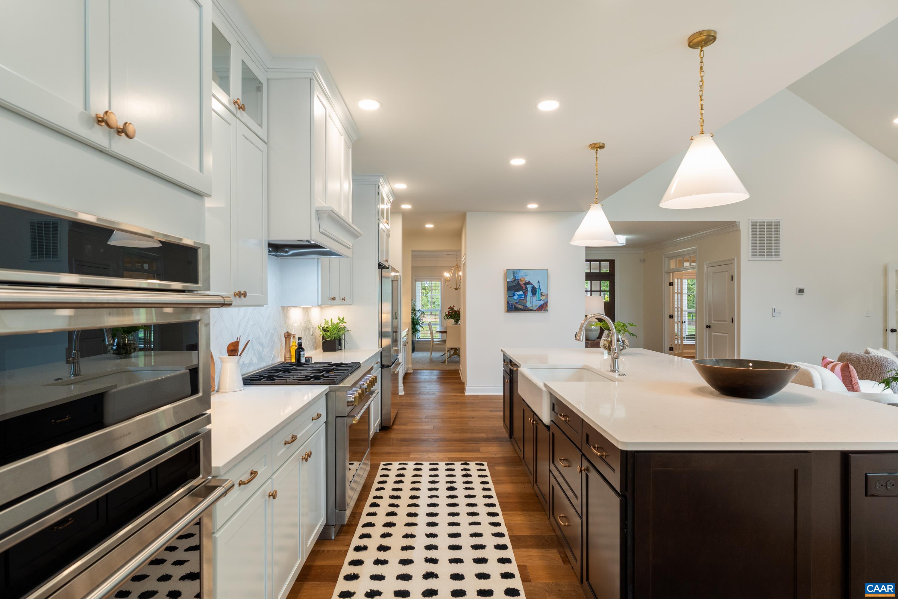 240 Campbell Road Keswick, VA 22947 - Photo 24 of 68 a kitchen with a sink stove and cabinets
