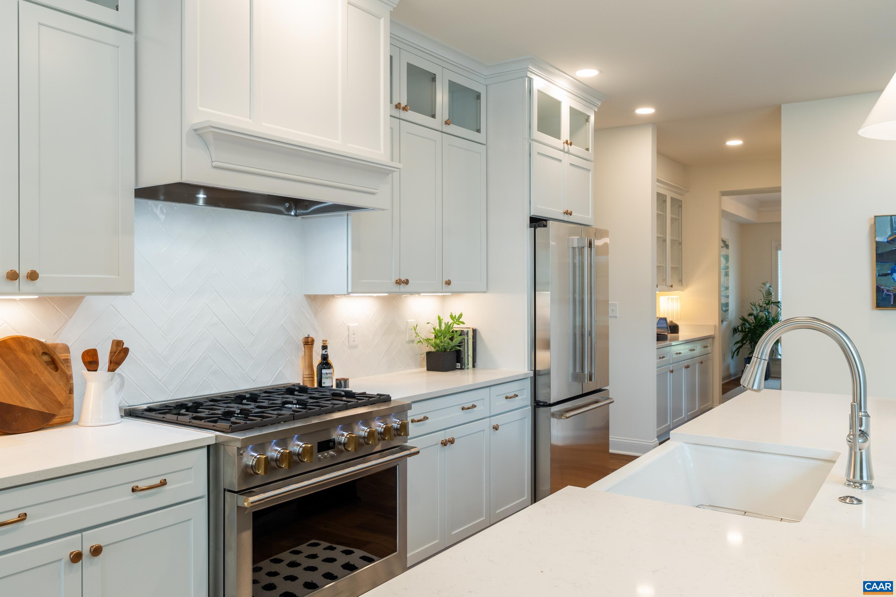 240 Campbell Road Keswick, VA 22947 - Photo 25 of 68 a kitchen with stainless steel appliances granite countertop a sink stove and refrigerator