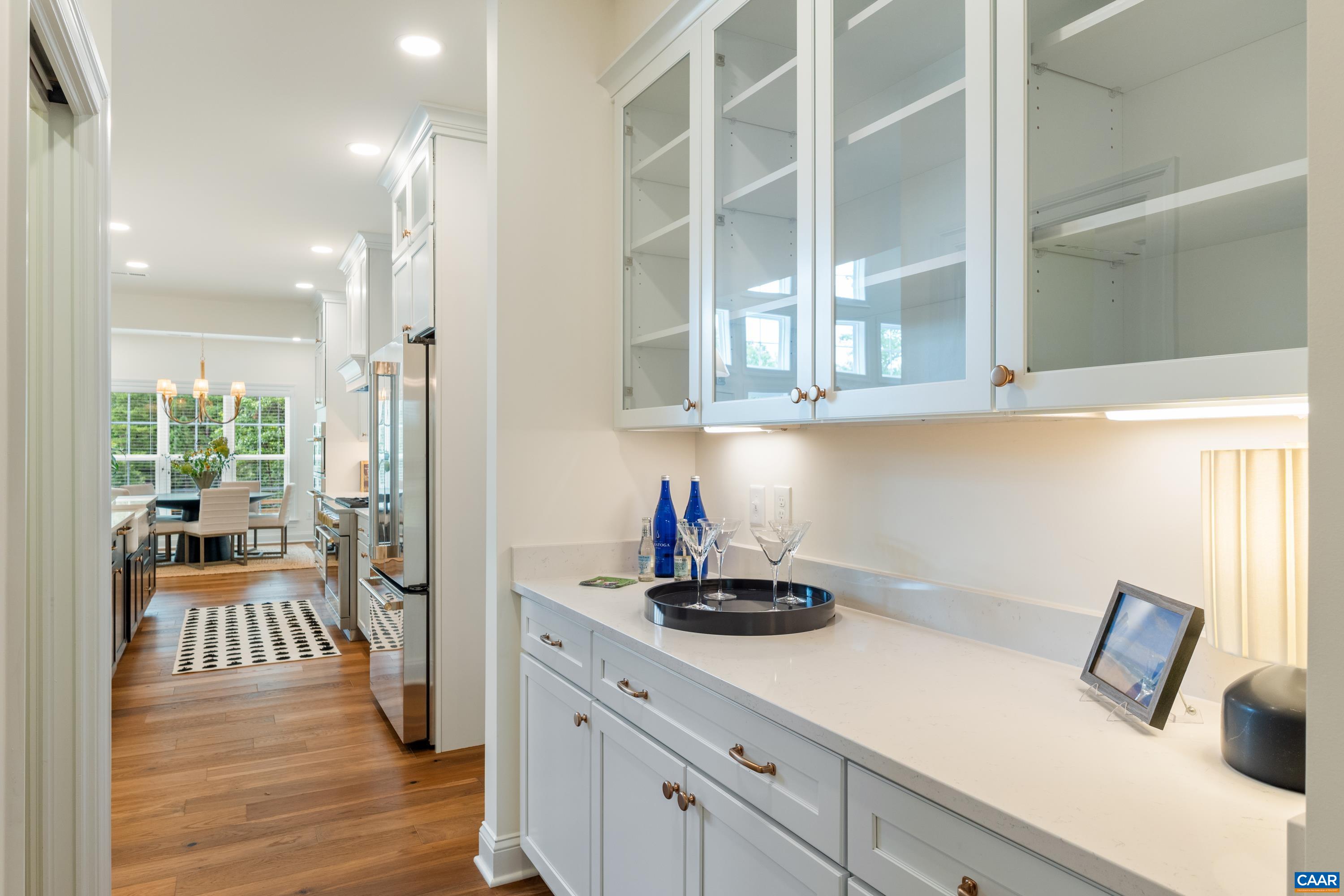 240 Campbell Road Keswick, VA 22947 - Photo 27 of 68 a kitchen with stainless steel appliances kitchen island granite countertop a refrigerator and a sink