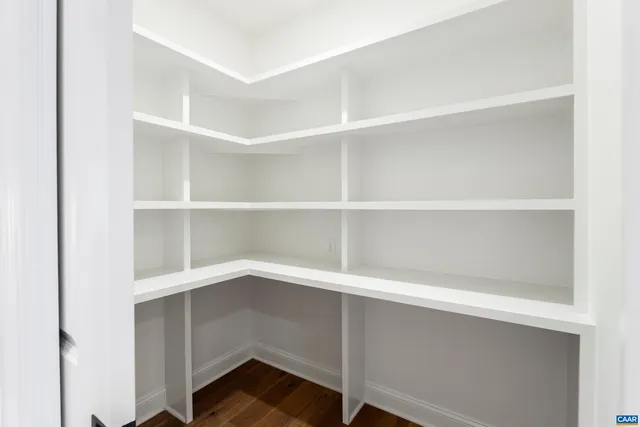 a bathroom with a granite countertop sink mirror and shower