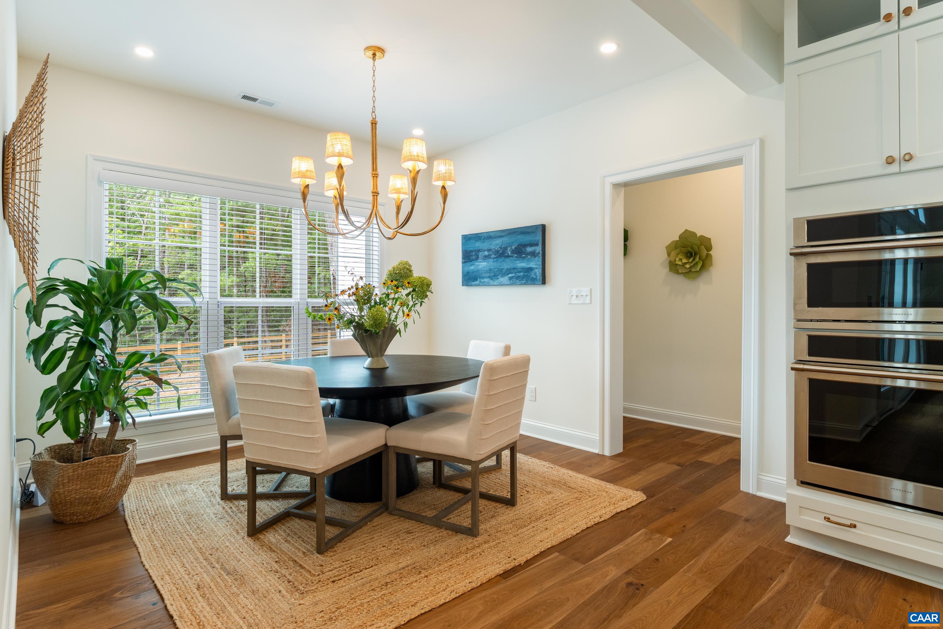 240 Campbell Road Keswick, VA 22947 - Photo 30 of 68 a view of a dining room with furniture window and wooden floor