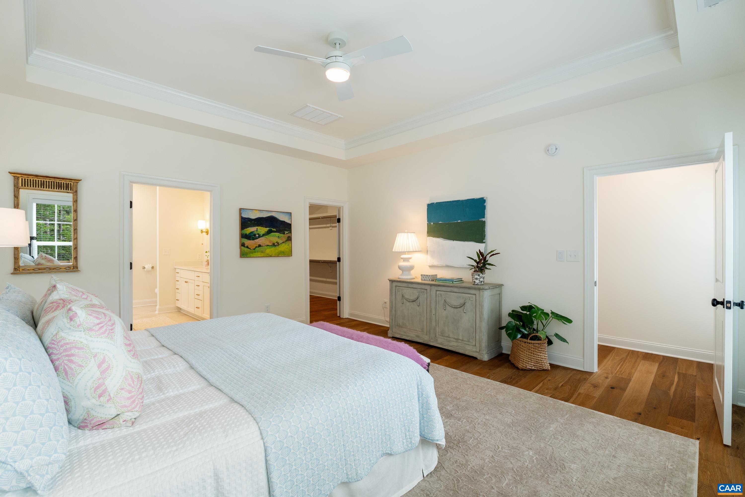 240 Campbell Road Keswick, VA 22947 - Photo 33 of 68 a bedroom with a bed and a flat tv screen on dresser