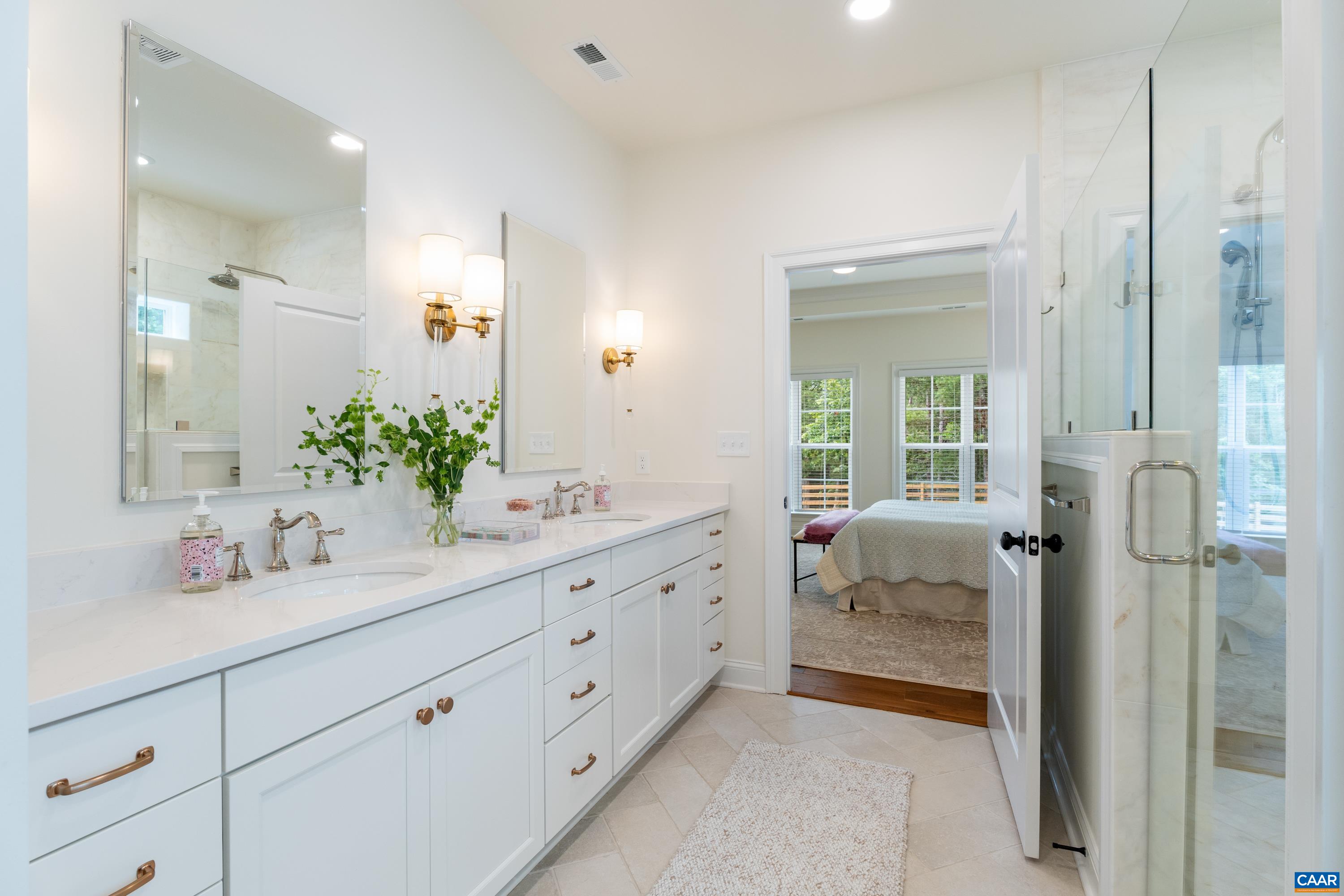 240 Campbell Road Keswick, VA 22947 - Photo 36 of 68 a bathroom with a granite countertop sink mirror and shower