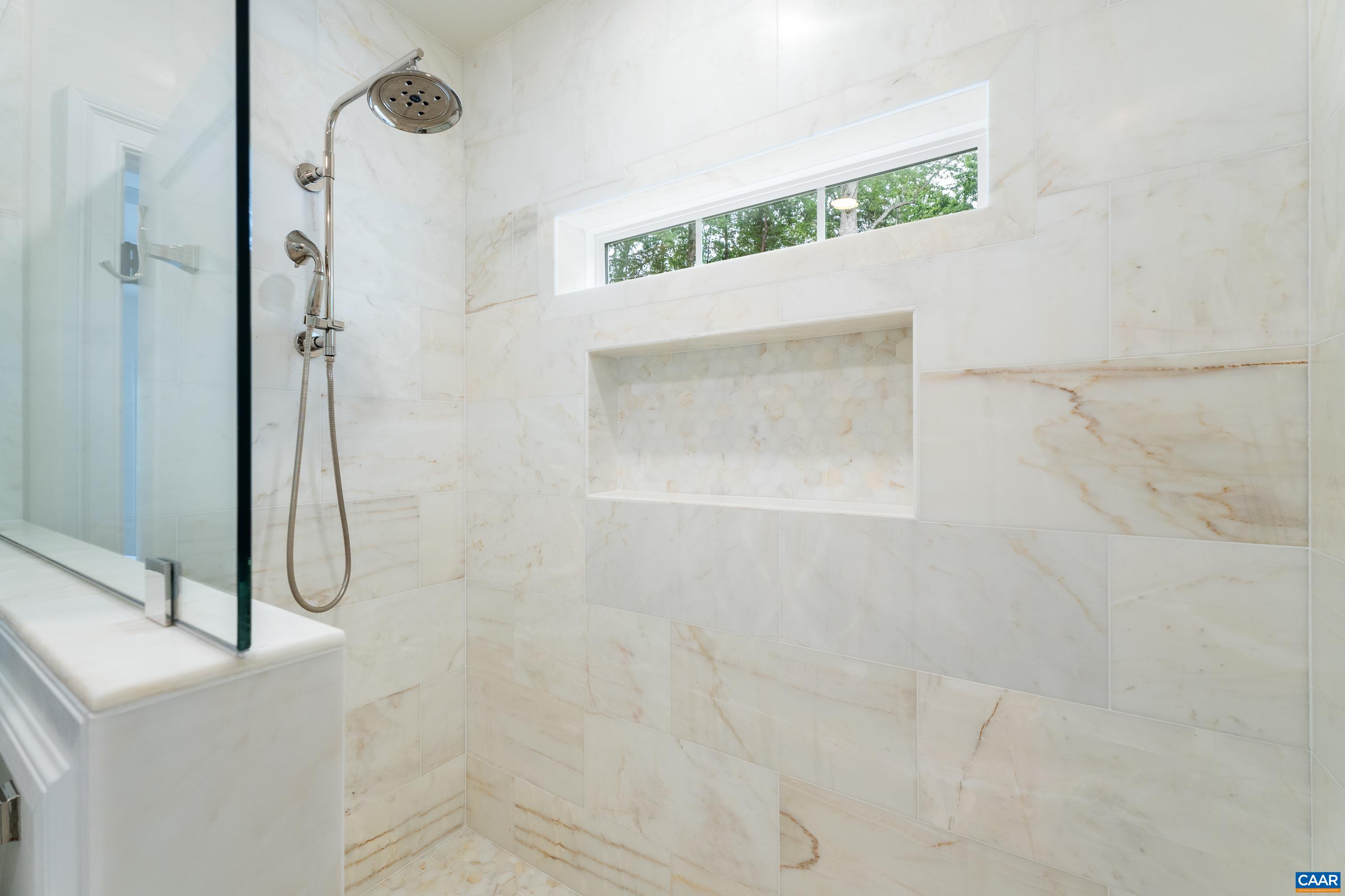 240 Campbell Road Keswick, VA 22947 - Photo 38 of 68 a bathroom with a glass shower door