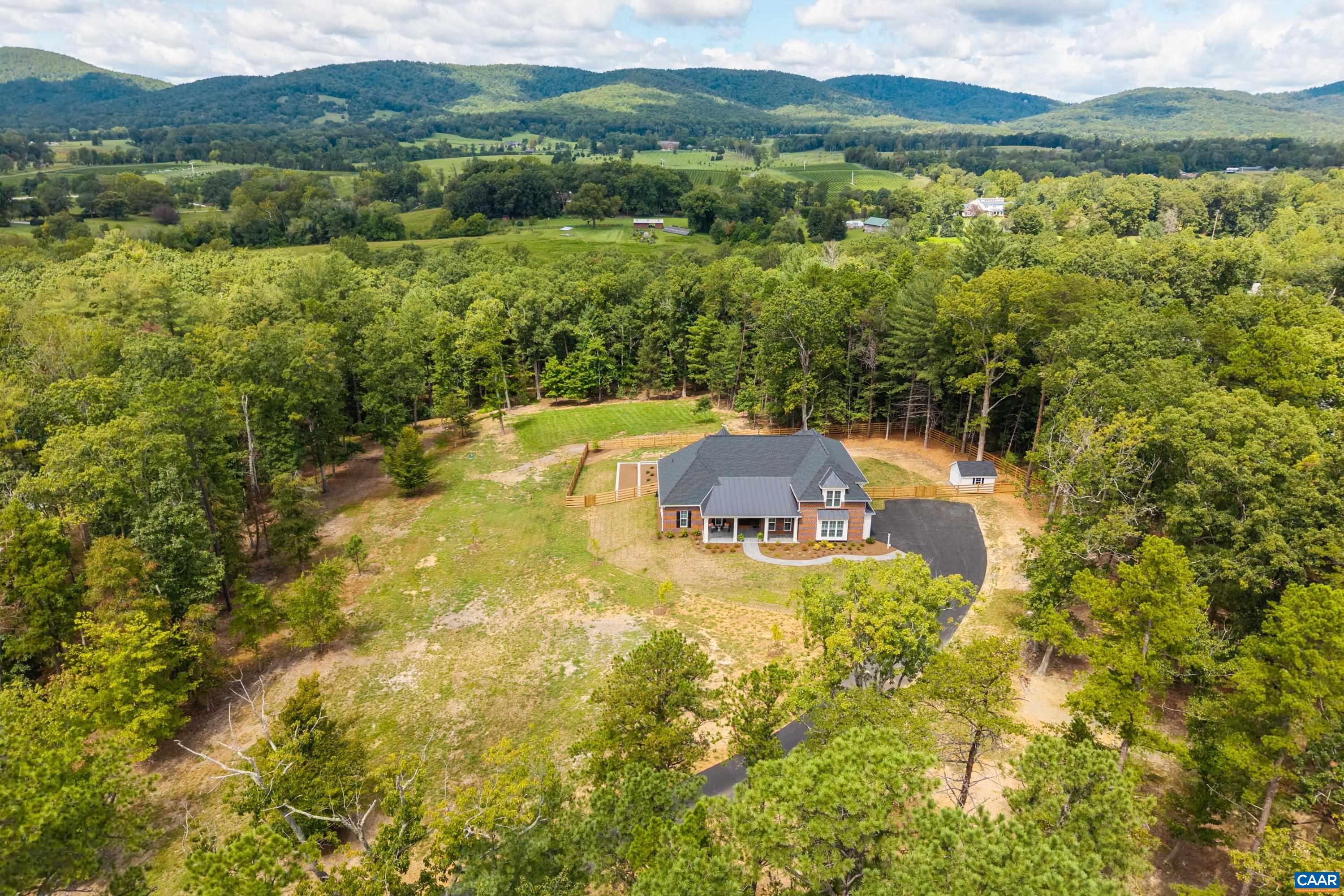 240 Campbell Road Keswick, VA 22947 - Photo 4 of 68 a view of a city with a lake view