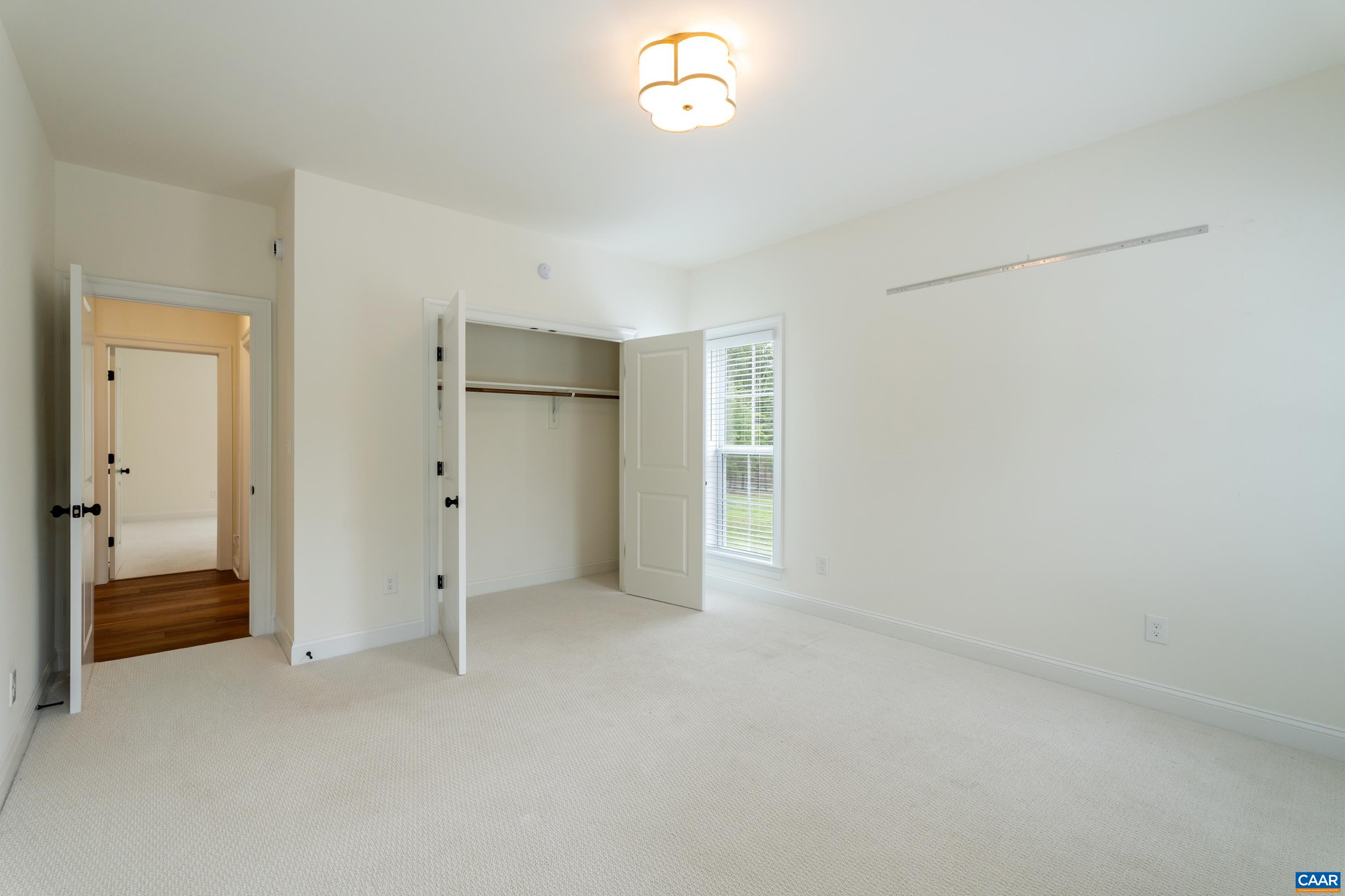 240 Campbell Road Keswick, VA 22947 - Photo 41 of 68 a view of an empty room with a closet