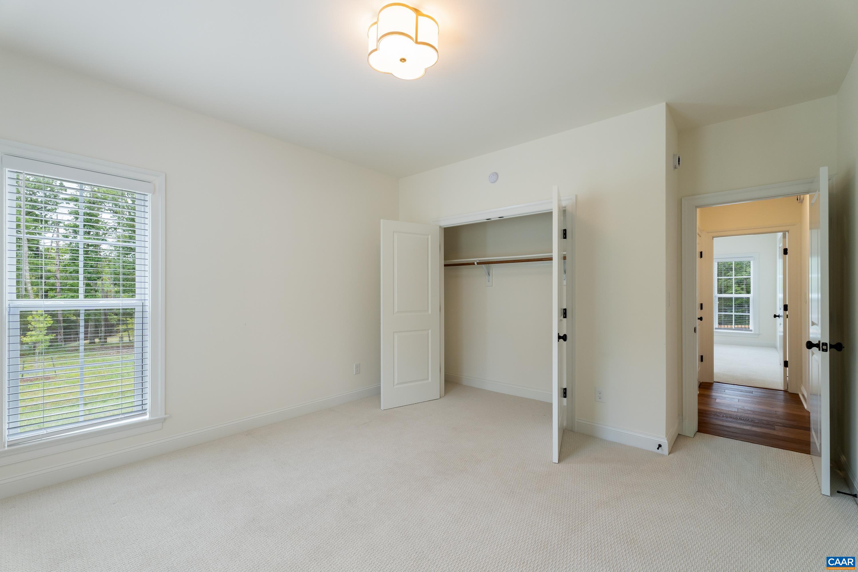 240 Campbell Road Keswick, VA 22947 - Photo 44 of 68 an empty room with windows and closet