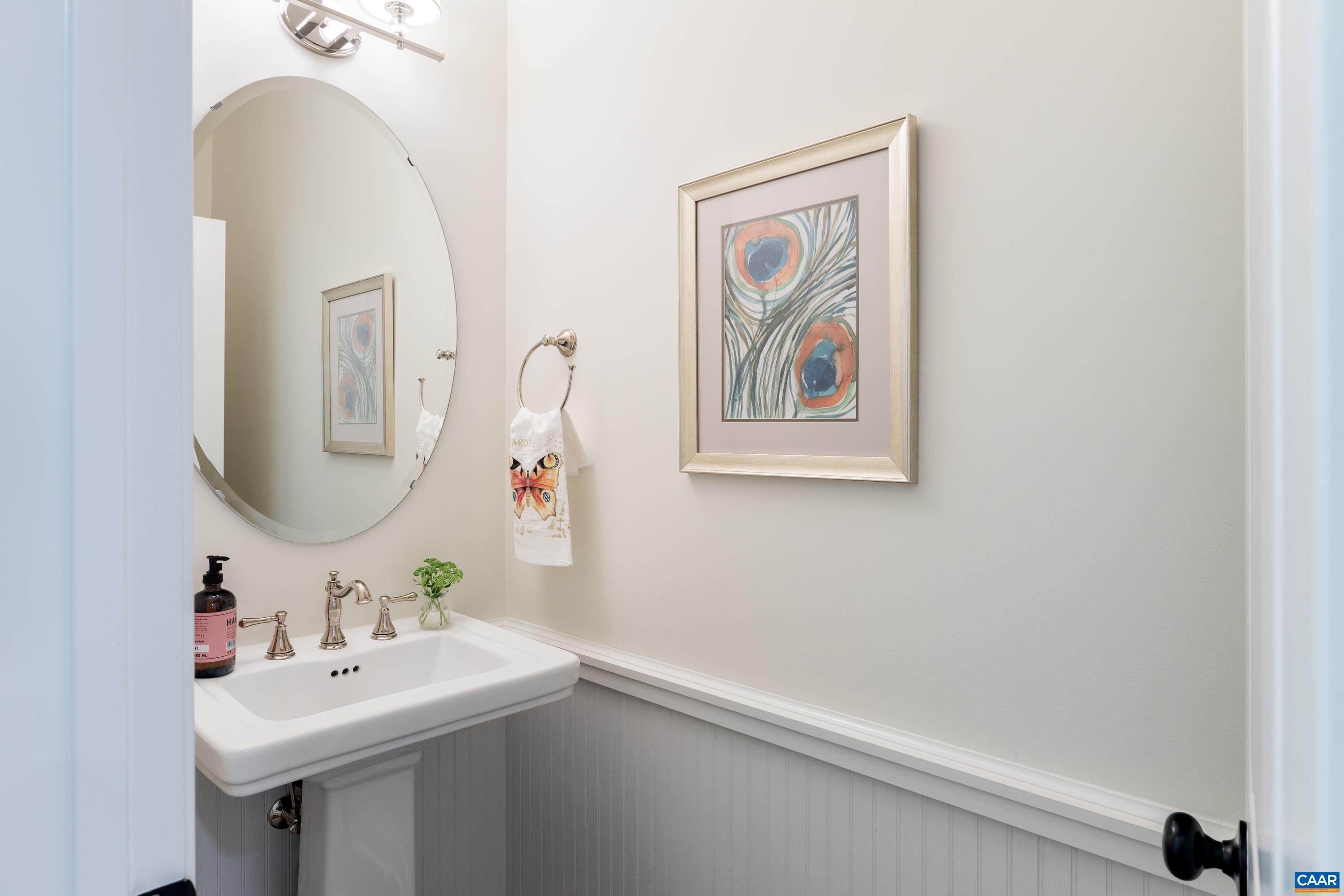 240 Campbell Road Keswick, VA 22947 - Photo 47 of 68 a bathroom with a sink and a mirror