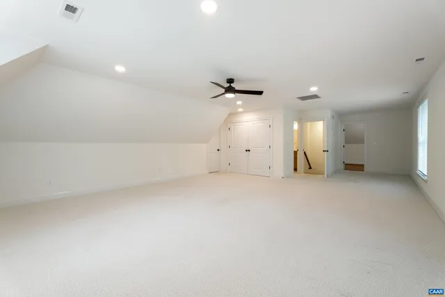 a view of a swimming pool with a yard