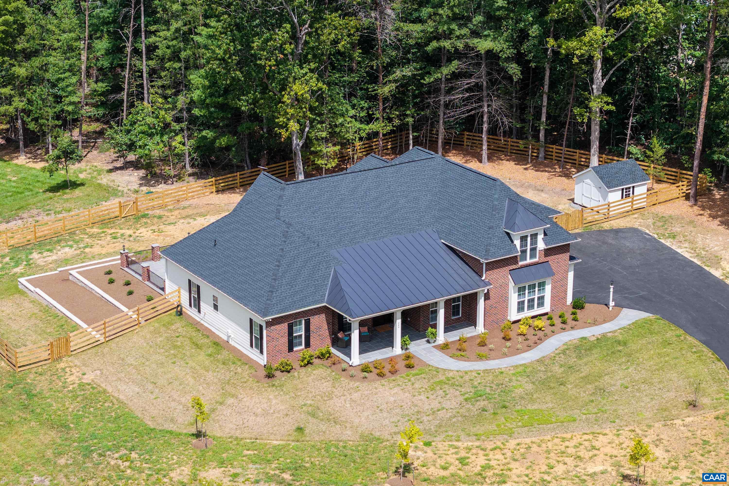 240 Campbell Road Keswick, VA 22947 - Photo 5 of 68 front view of a house with a yard
