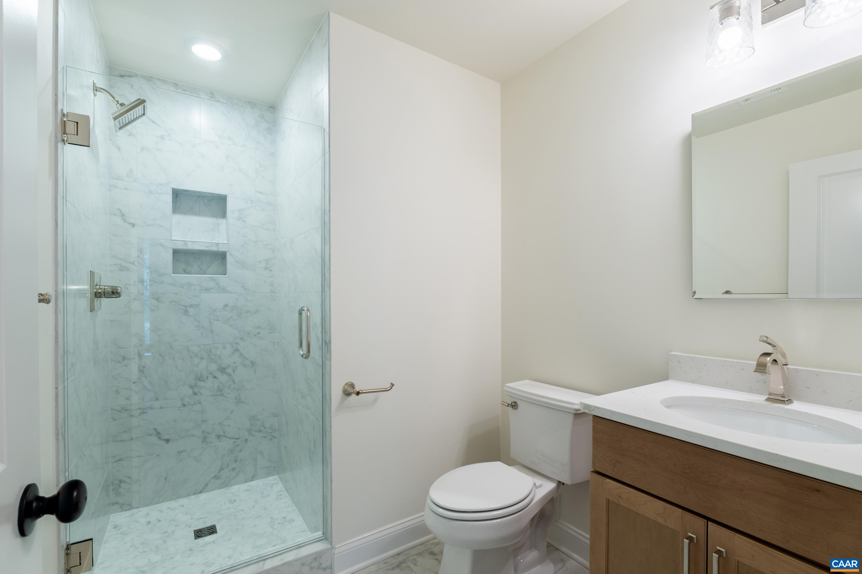 240 Campbell Road Keswick, VA 22947 - Photo 51 of 68 a bathroom with a sink toilet and shower