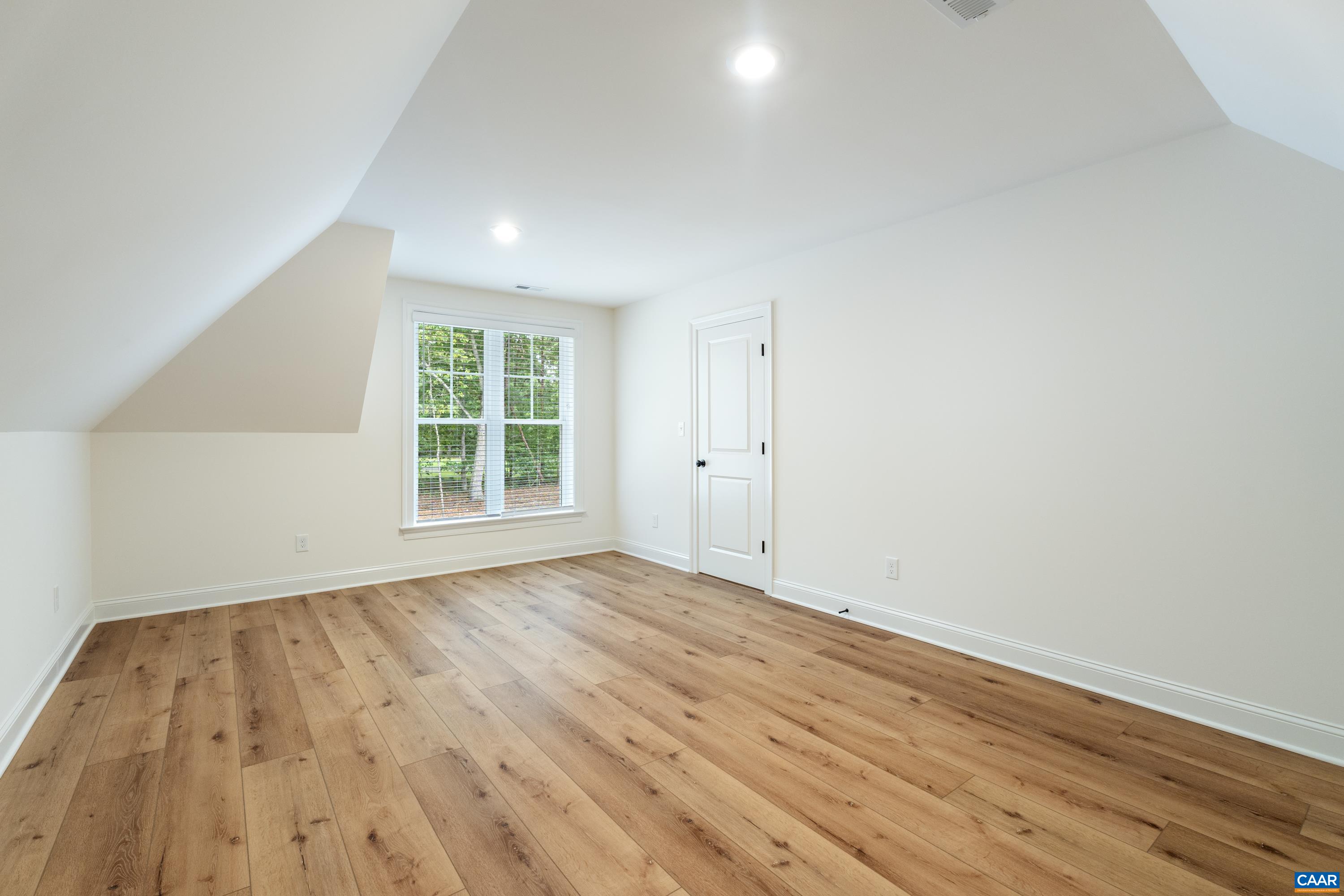 240 Campbell Road Keswick, VA 22947 - Photo 52 of 68 wooden floor in an empty room with a window