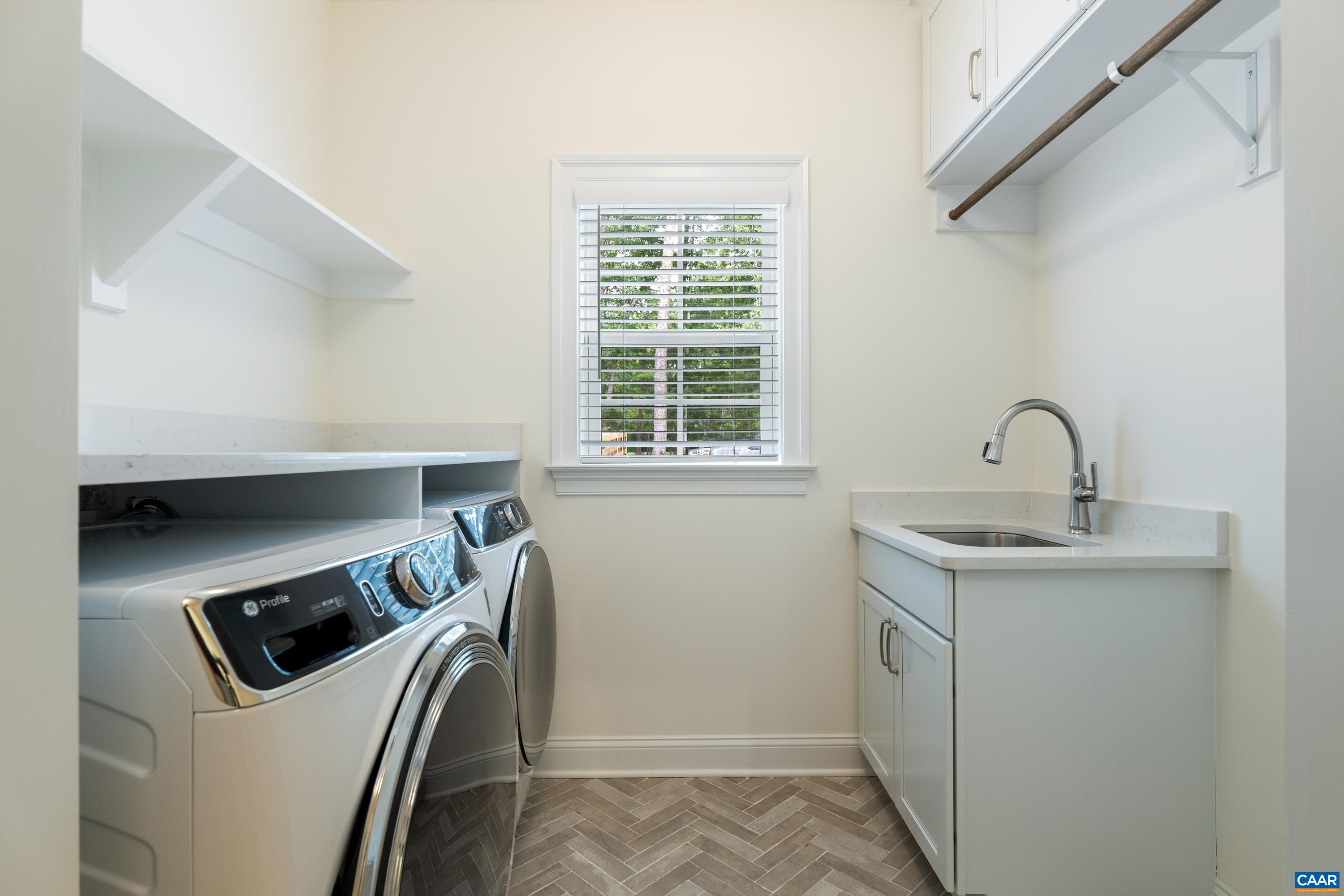 240 Campbell Road Keswick, VA 22947 - Photo 55 of 68 a utility room with a sink a washer and dryer