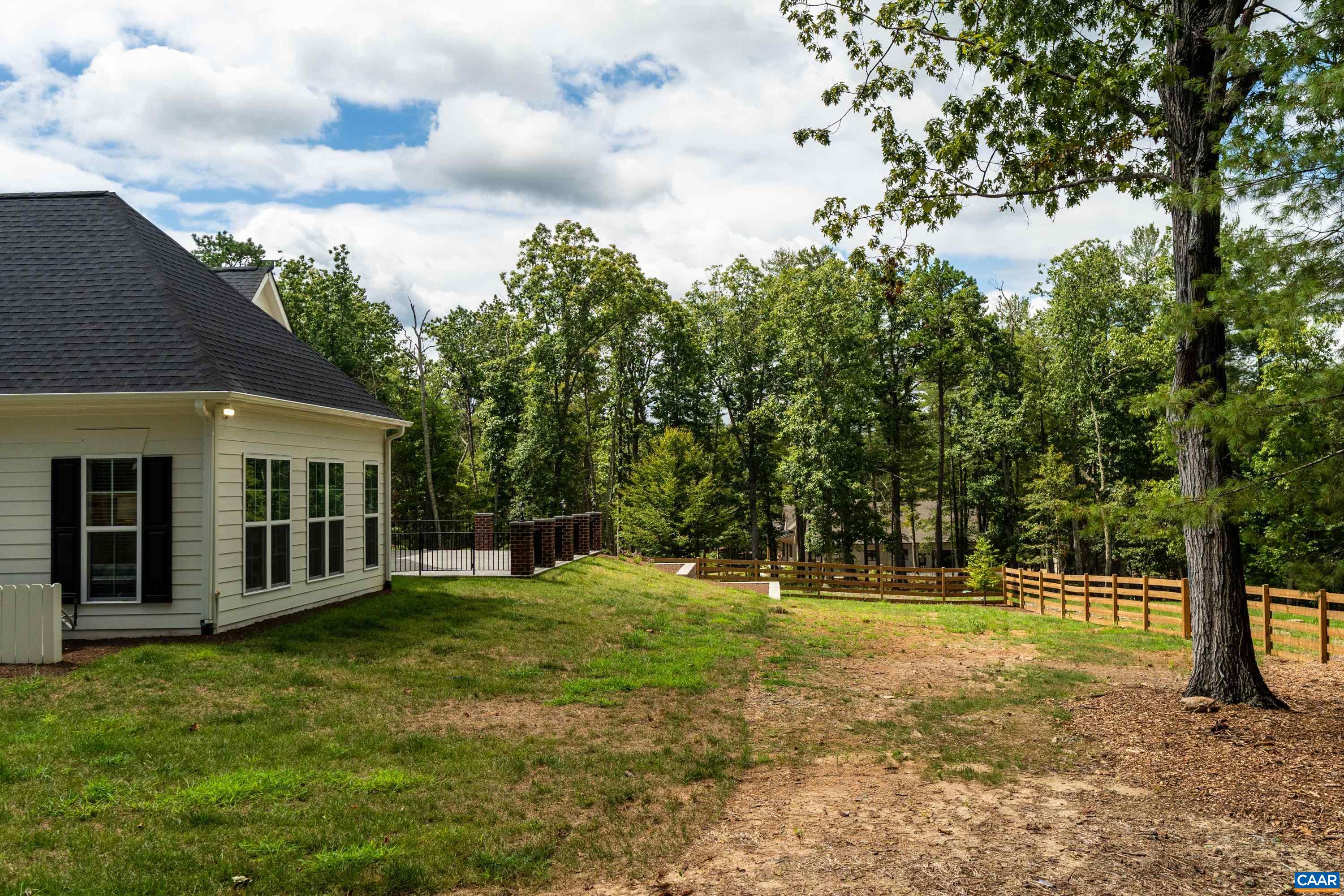 240 Campbell Road Keswick, VA 22947 - Photo 60 of 68 a view of a house with yard and sitting area
