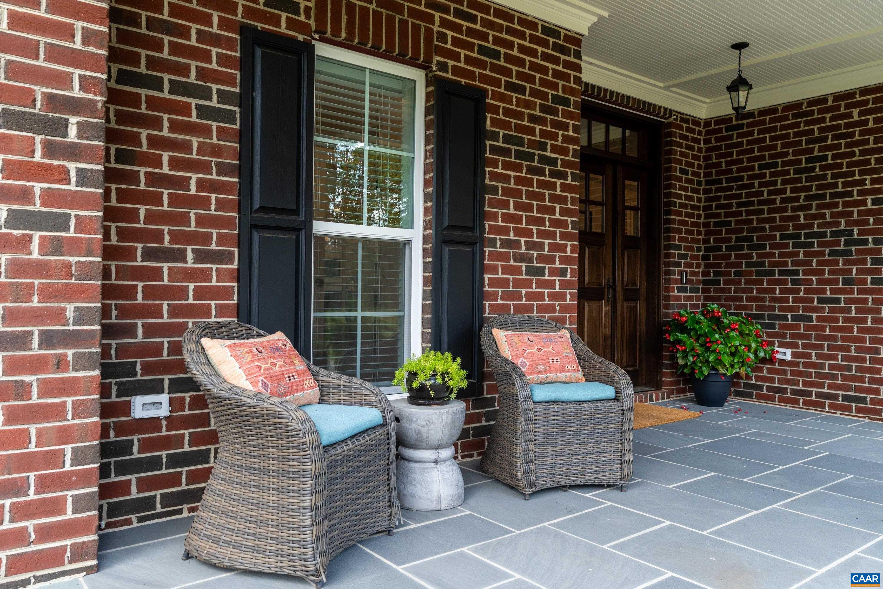 240 Campbell Road Keswick, VA 22947 - Photo 67 of 68 a building outdoor space with patio furniture and potted plants