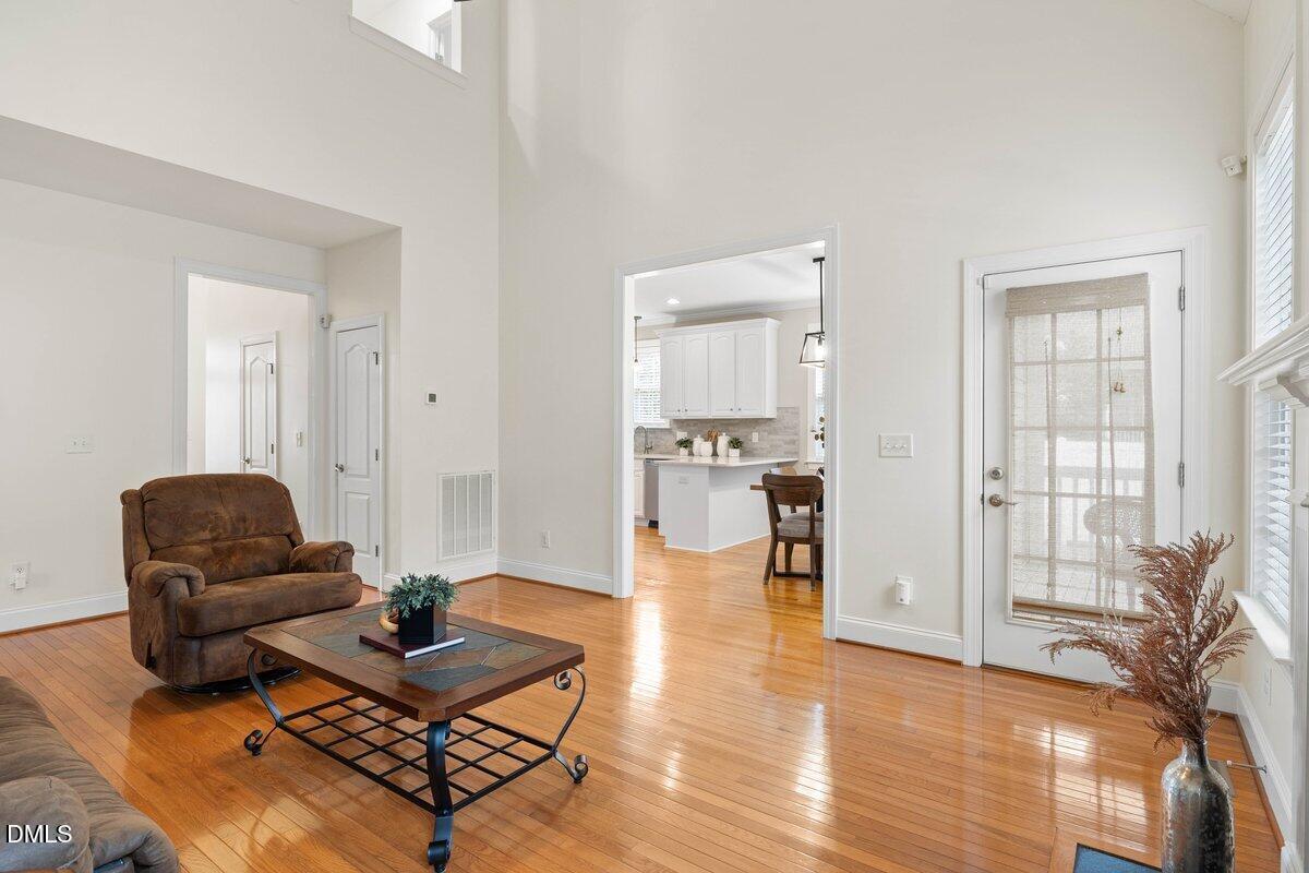 2000 Castana Court Willow Spring, NC 27592 - Photo 7 of 20 a living room with furniture and a wooden floor