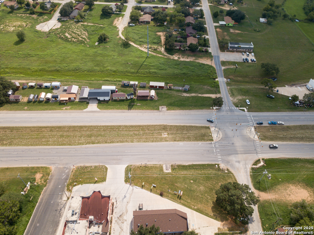 1804 Sutherland Springs Road Floresville, TX 78114 - Photo 17 of 23 an aerial view of a pool with a yard