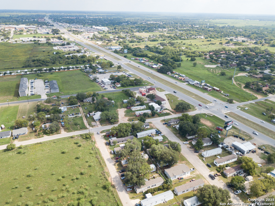 1804 Sutherland Springs Road Floresville, TX 78114 - Photo 3 of 23 an aerial view of residential houses with outdoor space