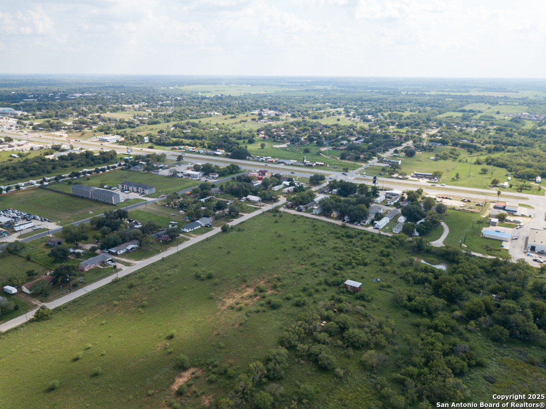 1804 Sutherland Springs Road Floresville, TX 78114 - Photo 4 of 23 an aerial view of residential houses with outdoor space and river
